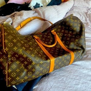 Louis Vuitton large travel bag 24.5 im length x 13 inches tall